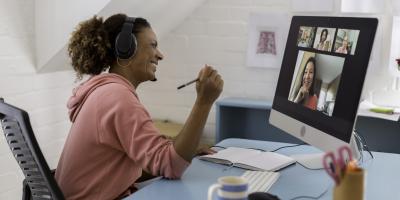 Woman in home office on video conference