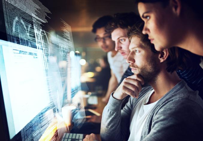 developers around a monitor