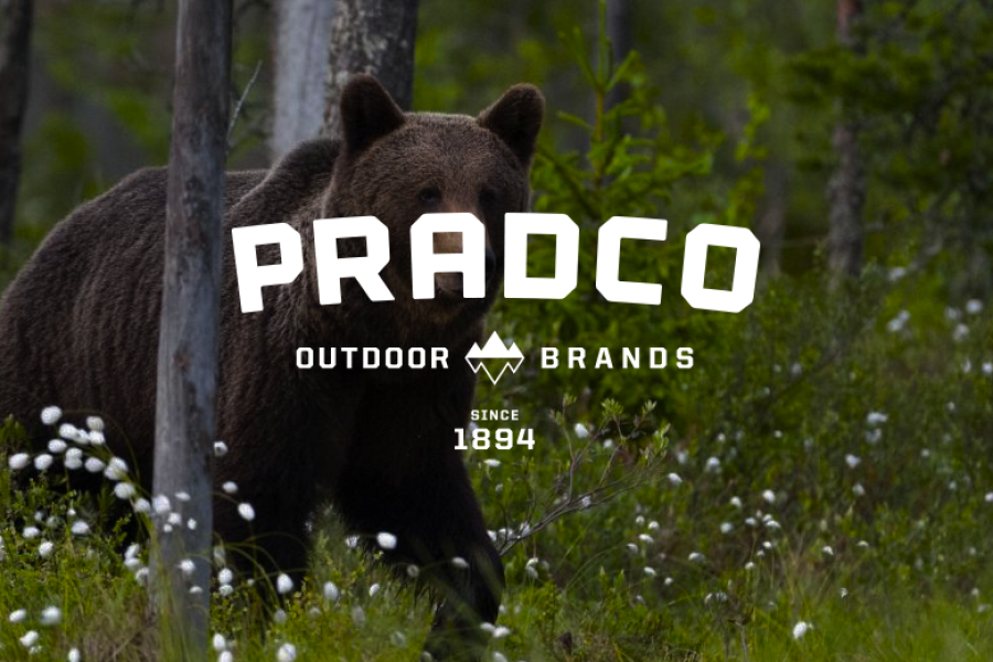 Image of bear in woods with Pradco logo over it
