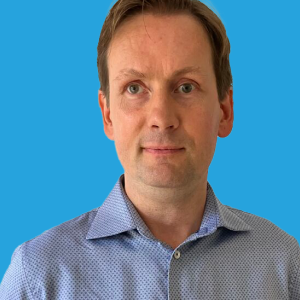 Lars Holm Sørensen Headshot on Light Blue Background