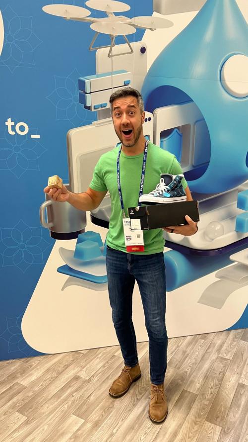 Winner holding Acquia x Converse shoes and he is STOKED